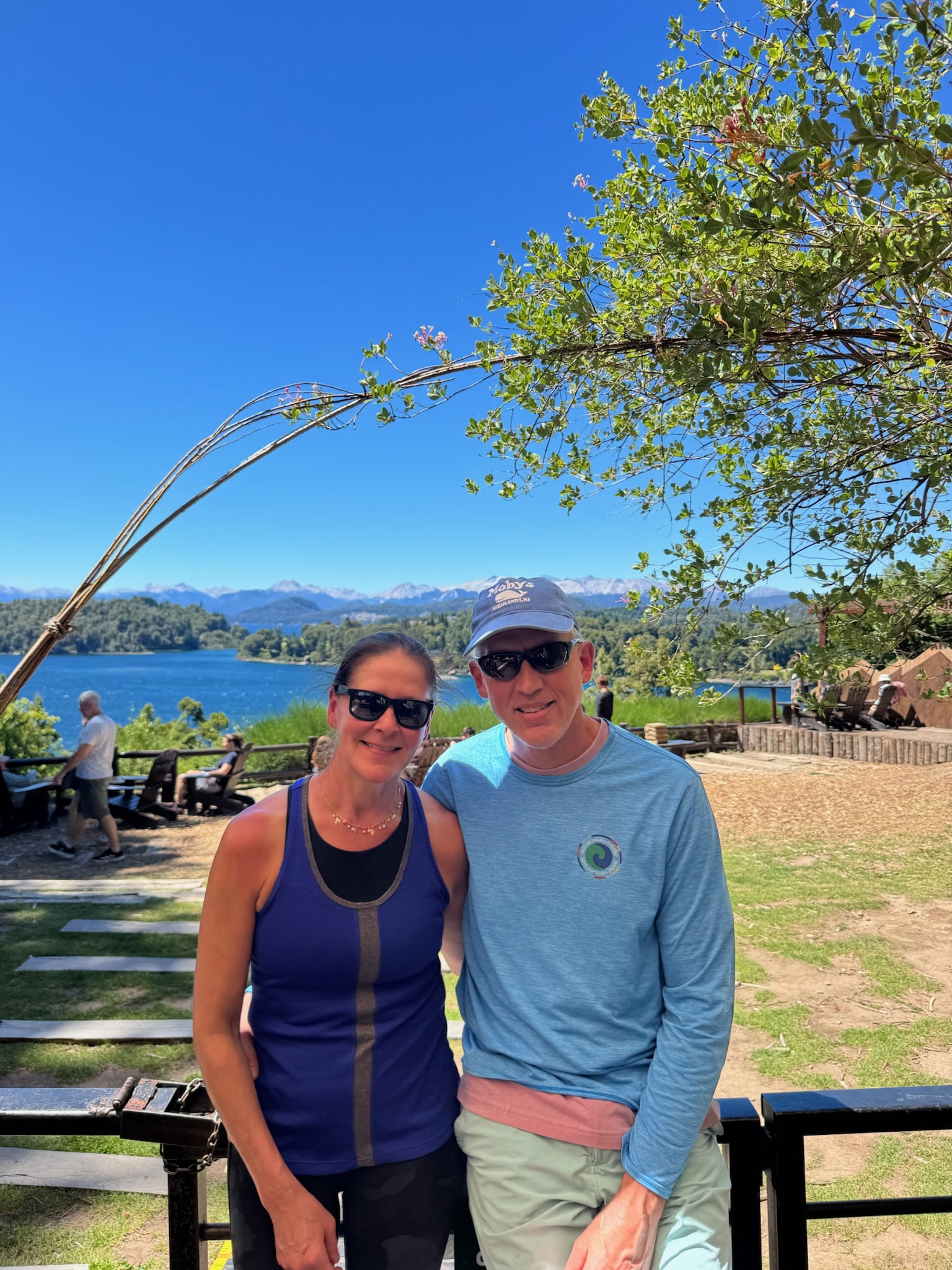 Couple posing by scenic lake in Bariloche Argentina in December