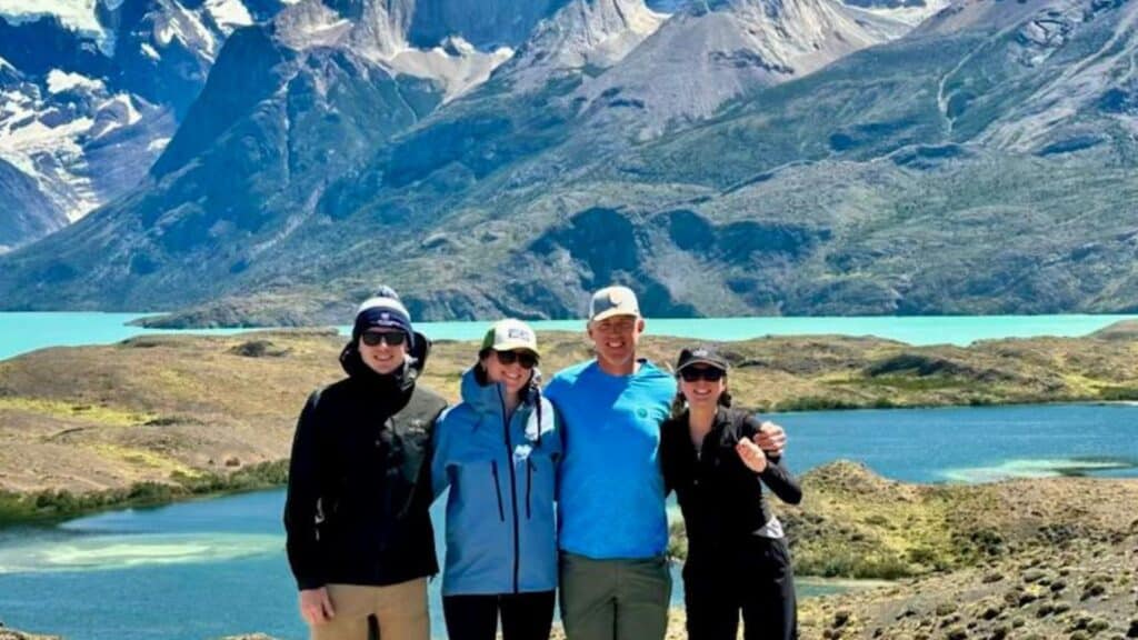 Group posing in scenic mountain landscape in Patagonia Argentina private tour